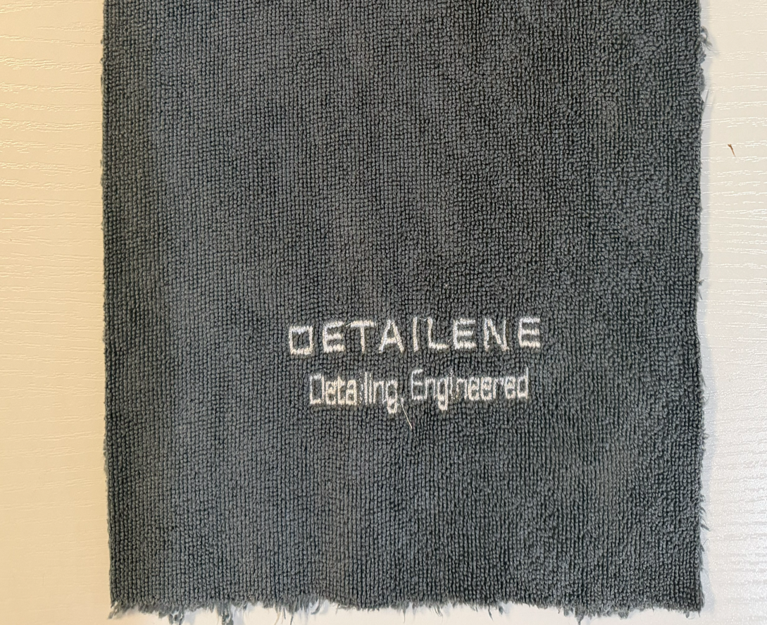 Charcoal Detailene microfiber towel with embroidered logo